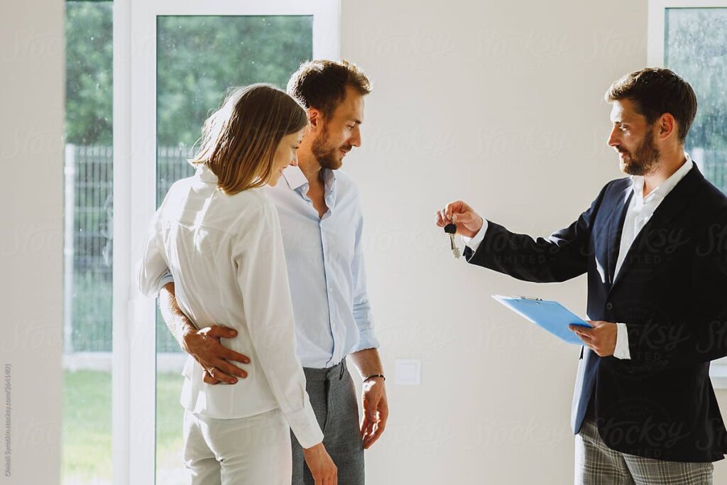 Real estate agents with clients